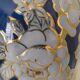 Cobalt blue porcelain vase from Limoges, France with floral pattern.