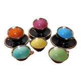 set of 9 black and gold Salins cups and saucers