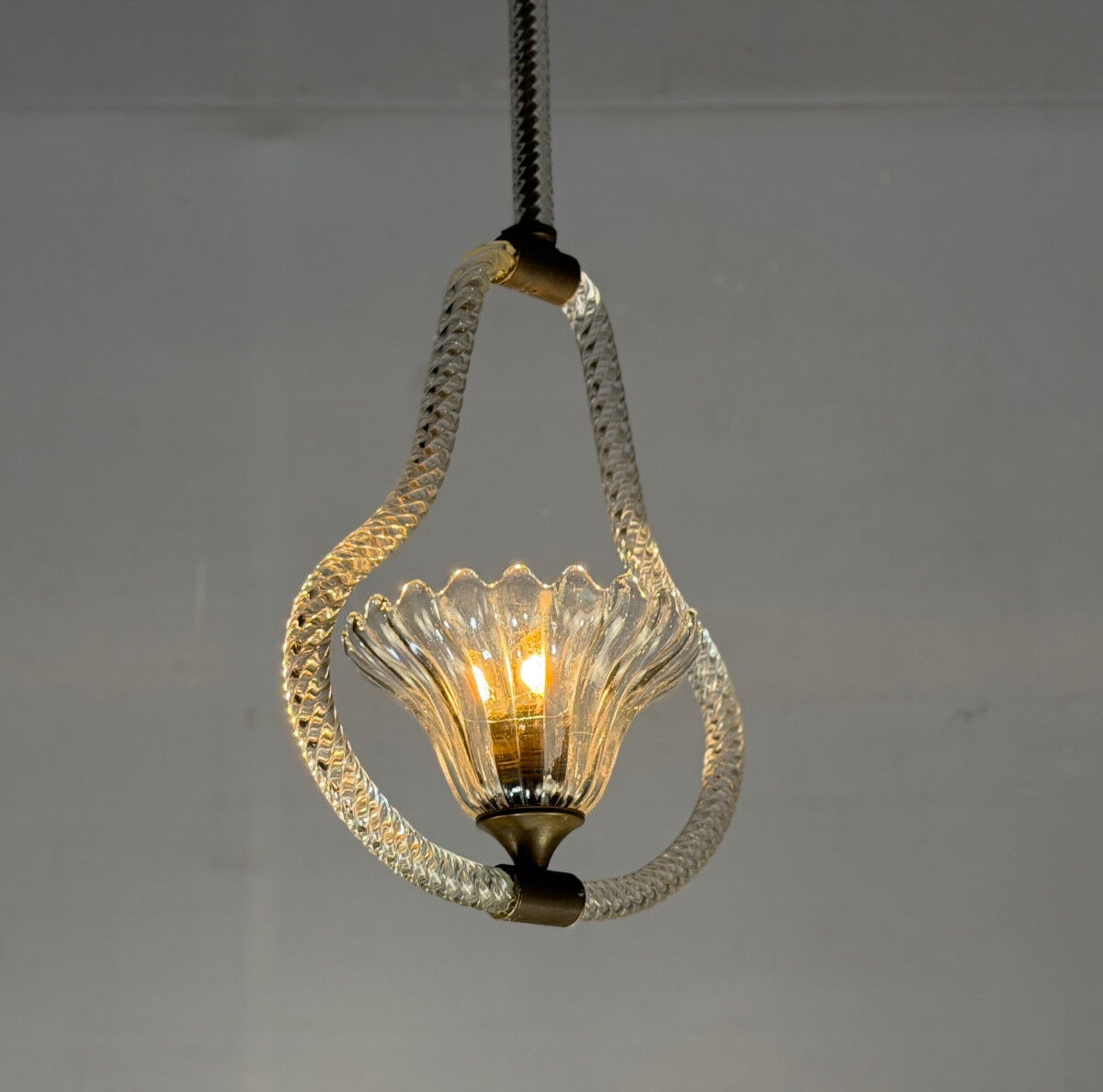 Venetian chandelier in colourless Murano glass and brass, circa 1950.