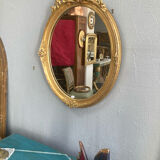 Miroir oval en bois doré 70x49cm