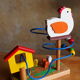 Game of awakening louping the hen and its 3 wooden chicks