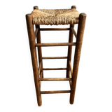 Low wooden and straw stool