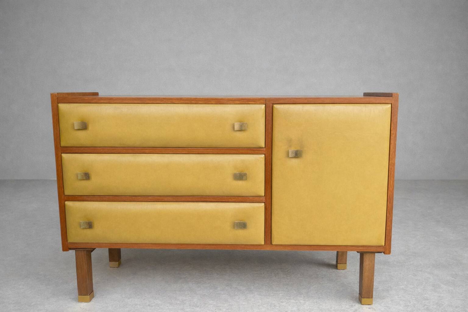 Vintage buffet/commode from the 50s-60s – Wood and mustard faux leather fronts.