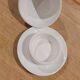 White porcelain butter dish accompanied by its matching bell.