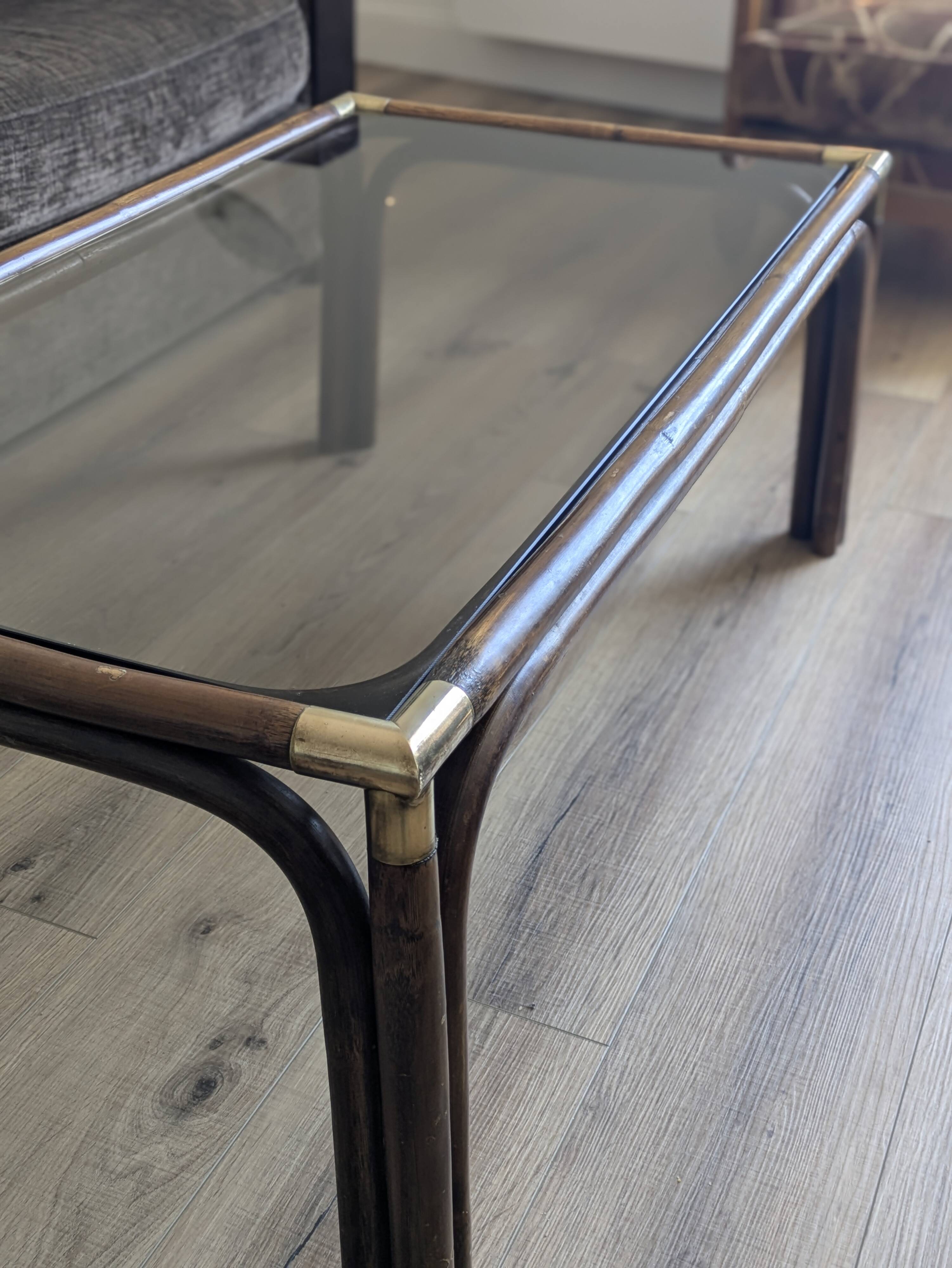 Bamboo coffee table with brass corners and smoked glass