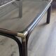 Bamboo coffee table with brass corners and smoked glass