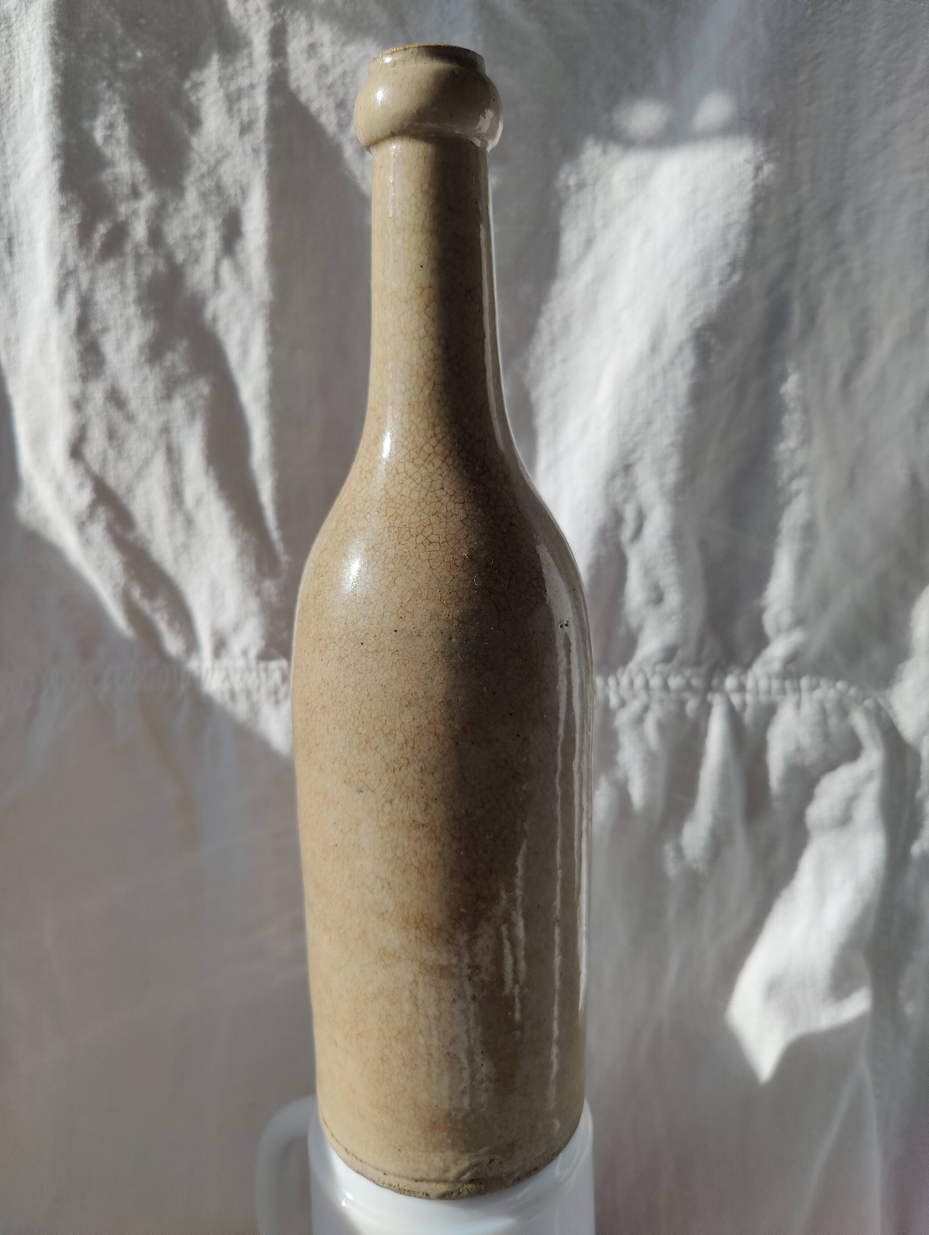 Vintage enamelled stoneware bottle