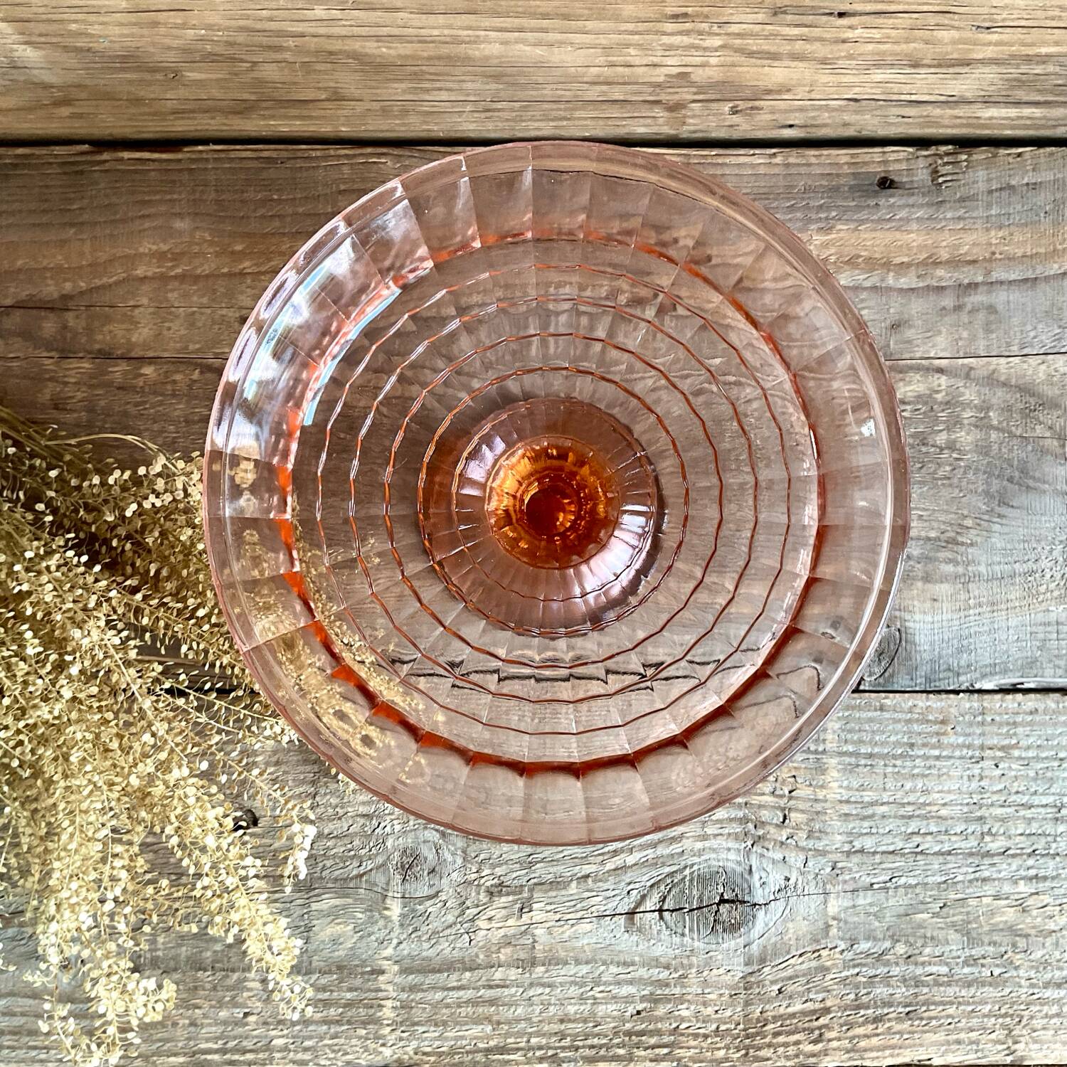 Pink glass cup, fruit bowl