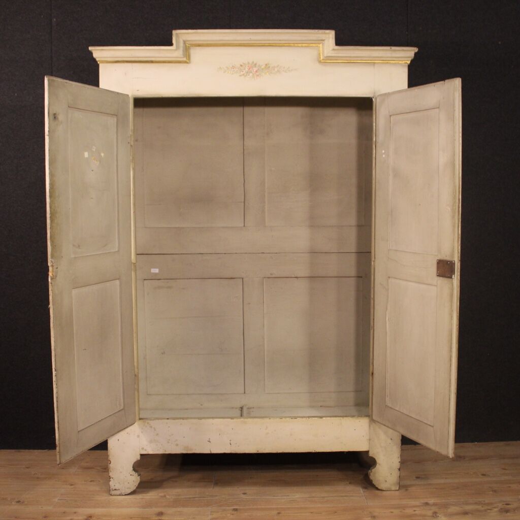 Antique lacquered and gilded Italian wardrobe in Louis XVI style from 19th century
