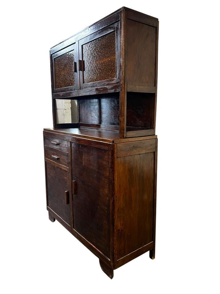 Vintage wooden display cabinet with yellow glass.