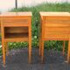 Pair of walnut bedside tables in Louis XVI style with brass inlay.