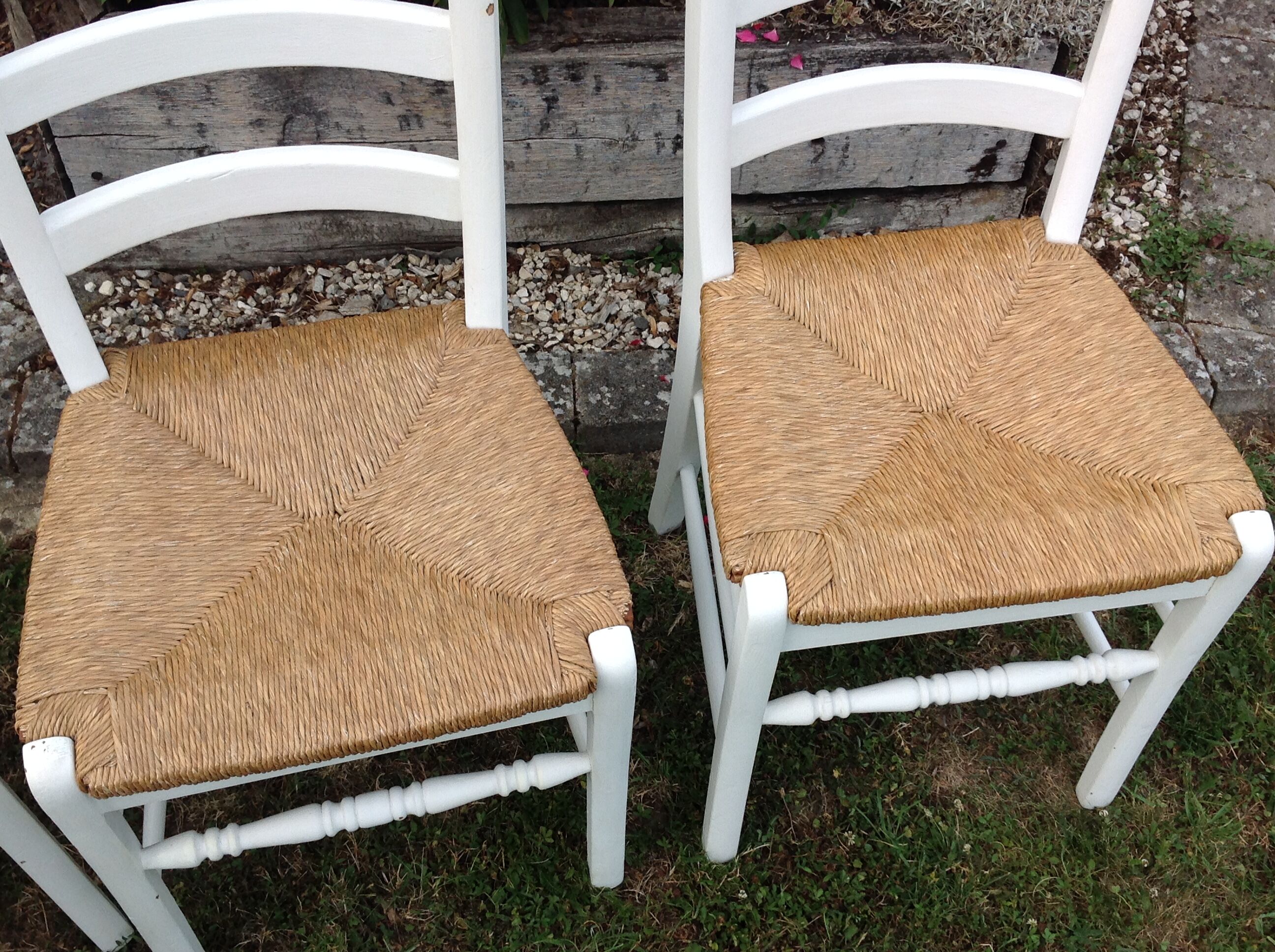 White farmhouse table set and four chairs