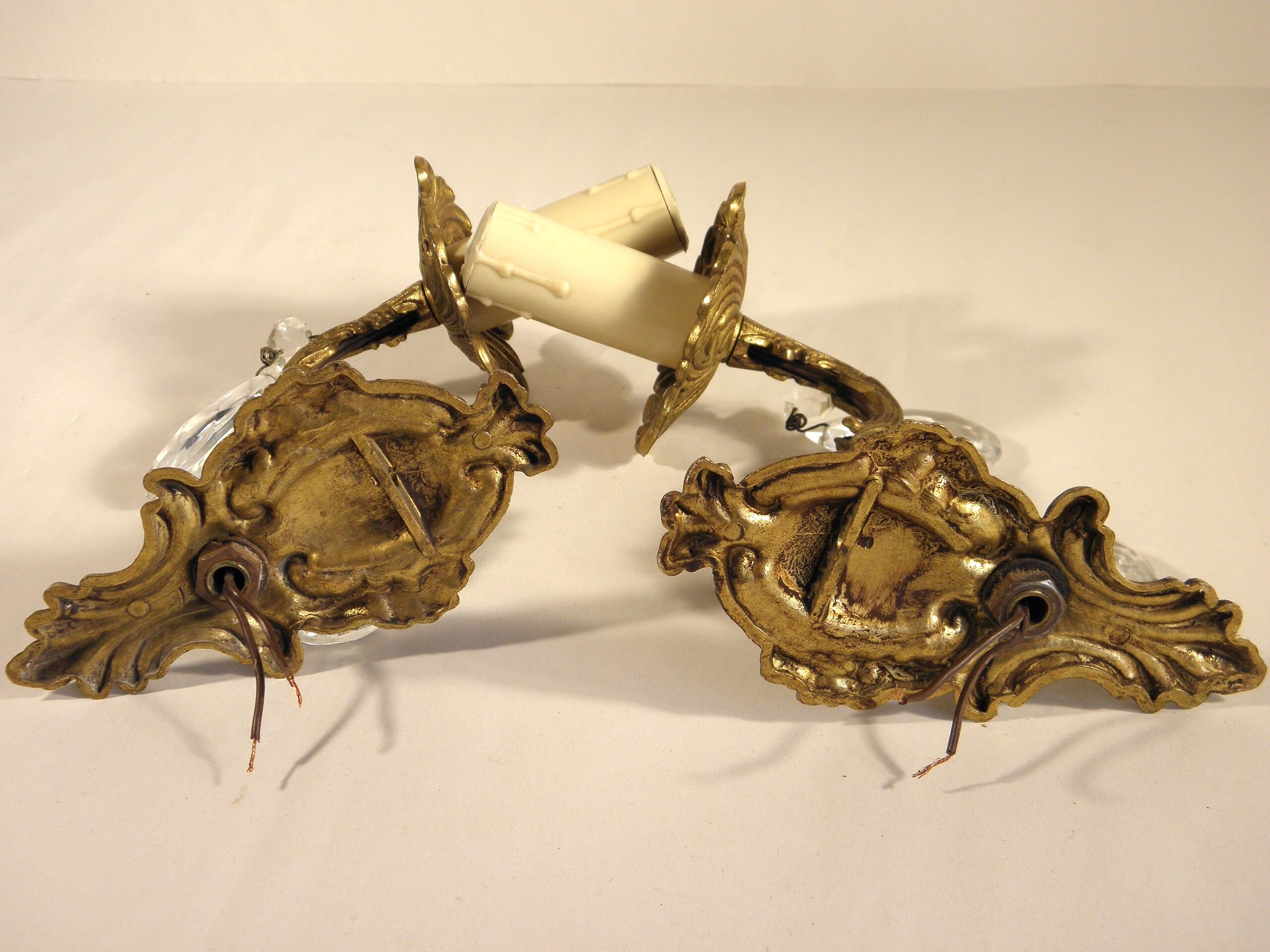 Pair of wall clams in gilded bronze stamps