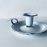 Old candle holder in white enameled metal