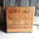 Old wooden chest of drawers with 4 drawers on wheels