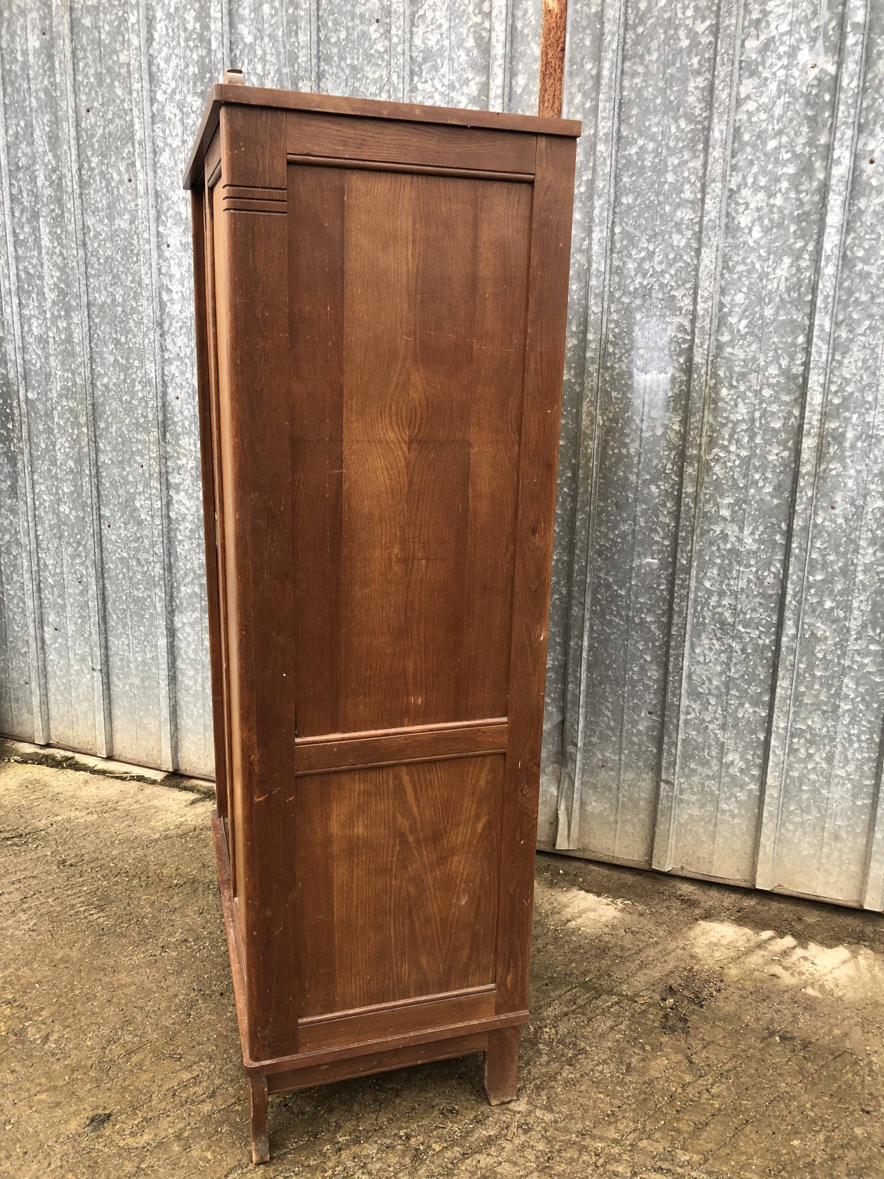 Vintage reconstruction period oak wardrobe with 2 sliding doors.
