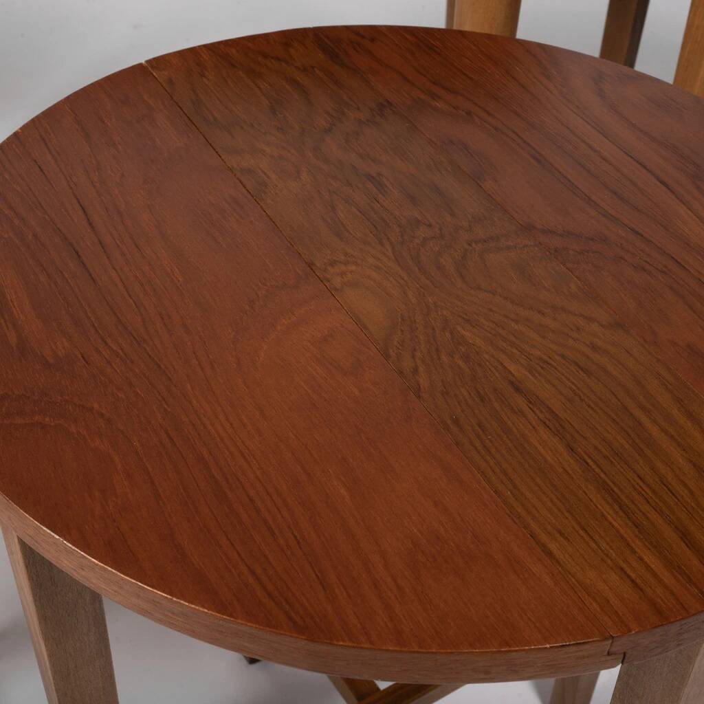 Table and four chairs set by Paul Hundevad