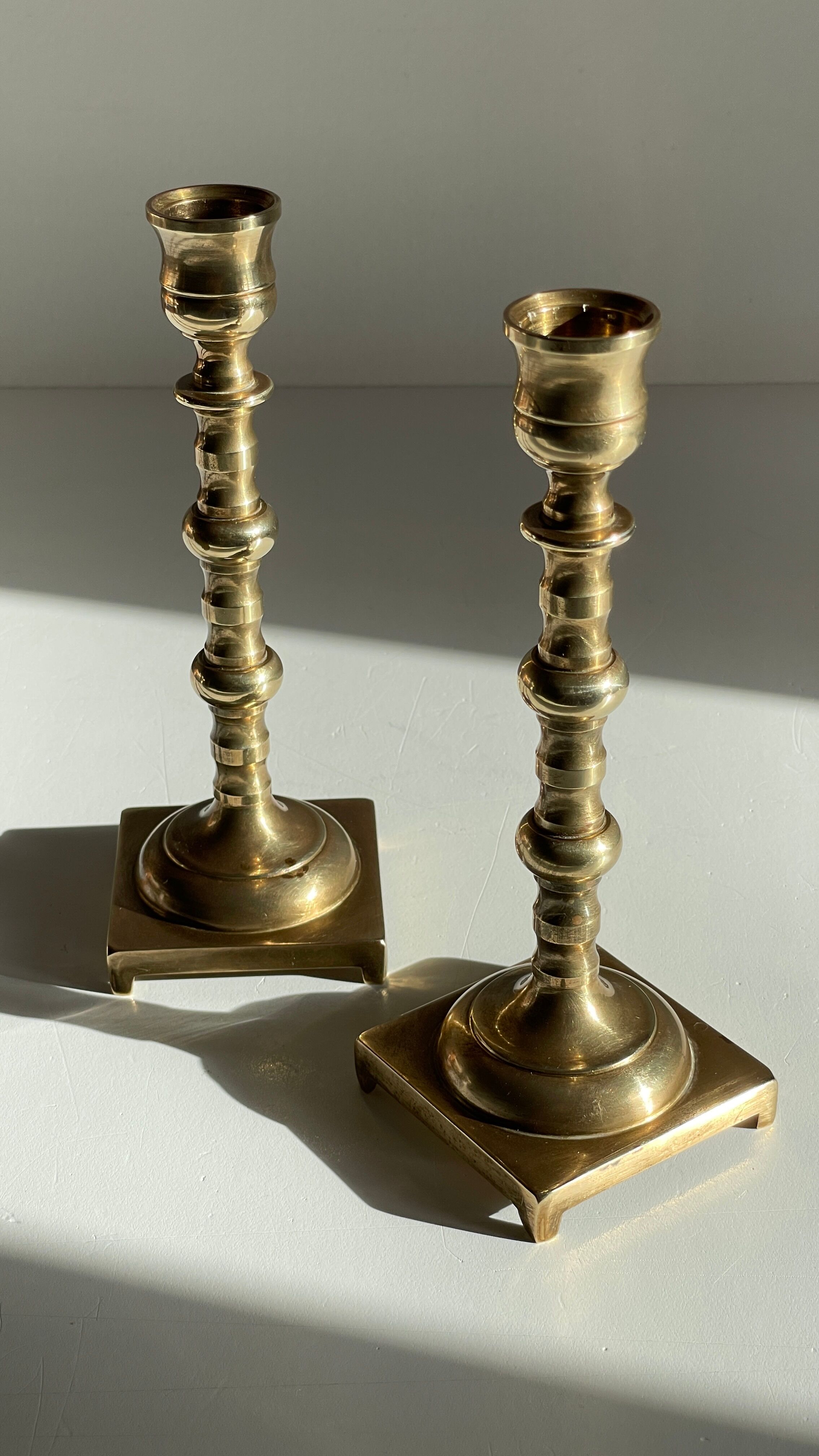 Pair of brass candle holders made in England