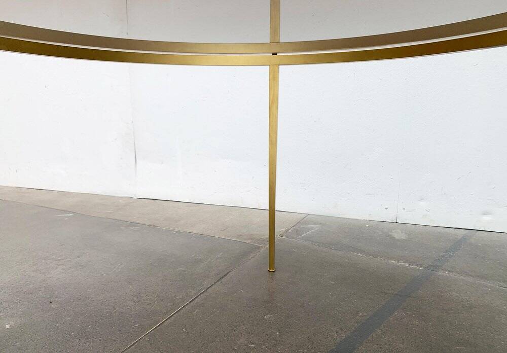 Mid-century Hollywood Regency style coffee table in brass and glass, made in Germany by Vereinigte Werkstätten, 1960s.