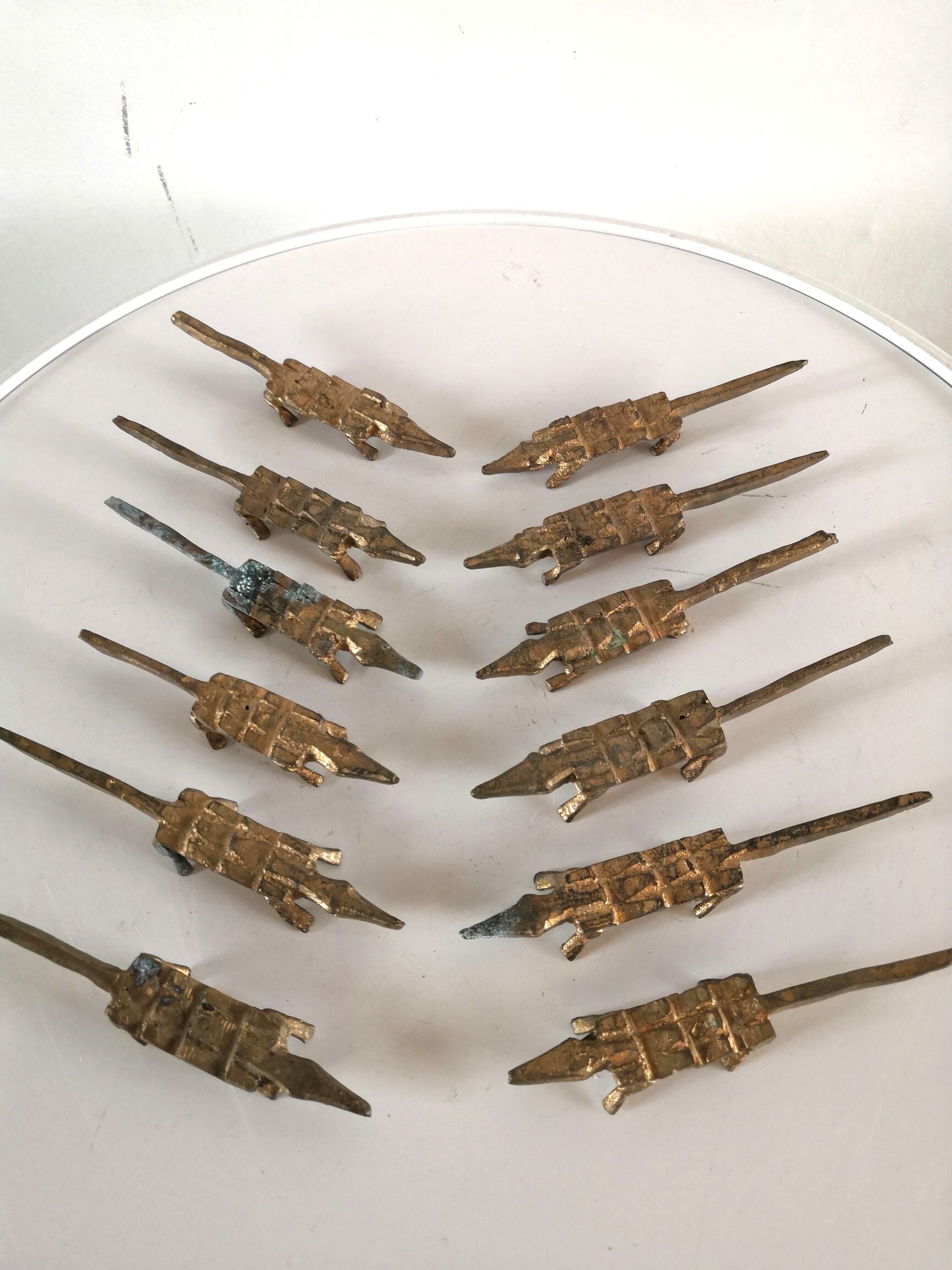 12 vintage bronze knife rests