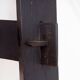 Vintage black-stained wooden tripod stool with mortise joints.