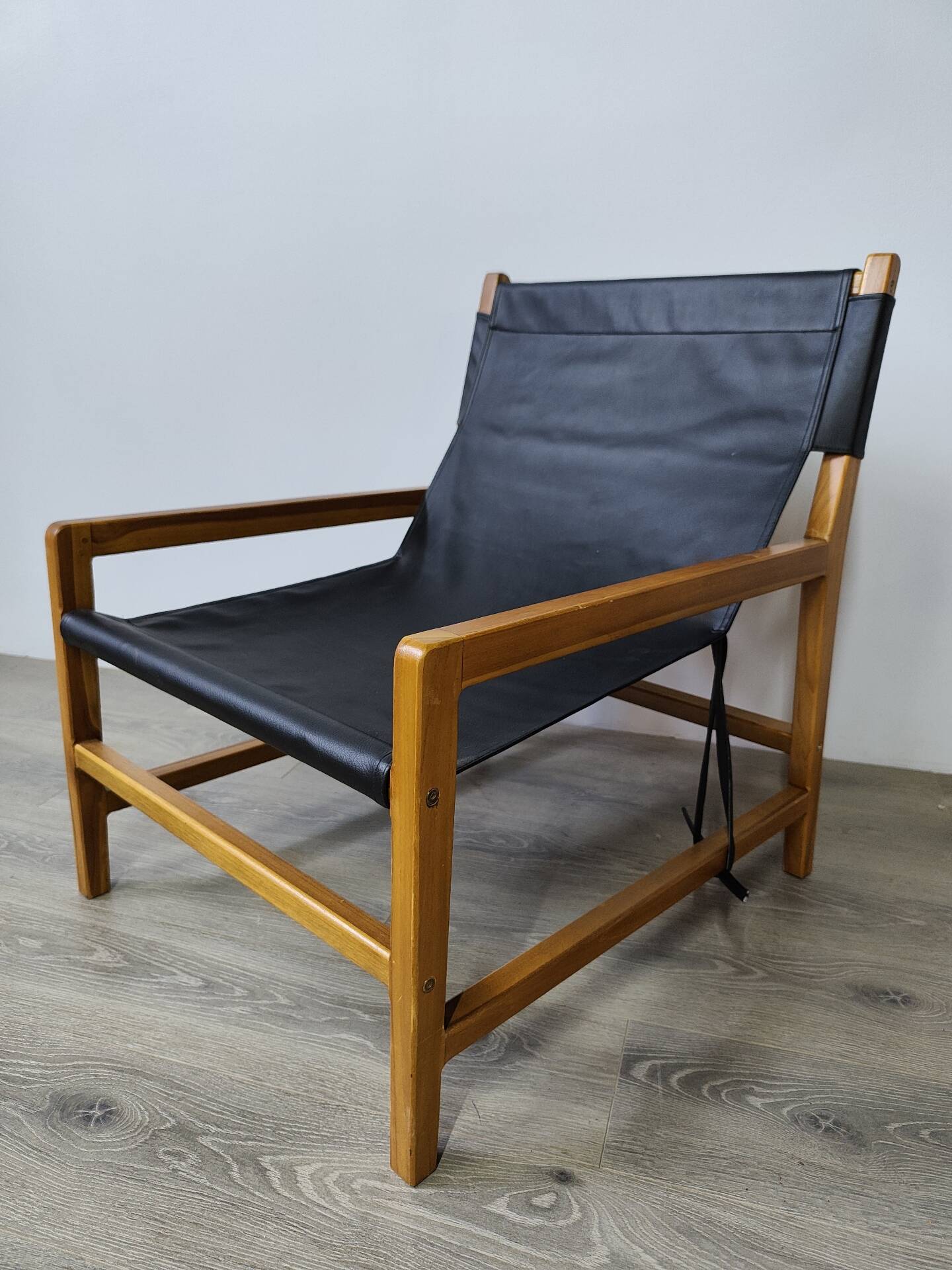 Leather and teak armchair