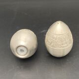 Egg-shaped metal salt and pepper shakers with Asian countryside motif