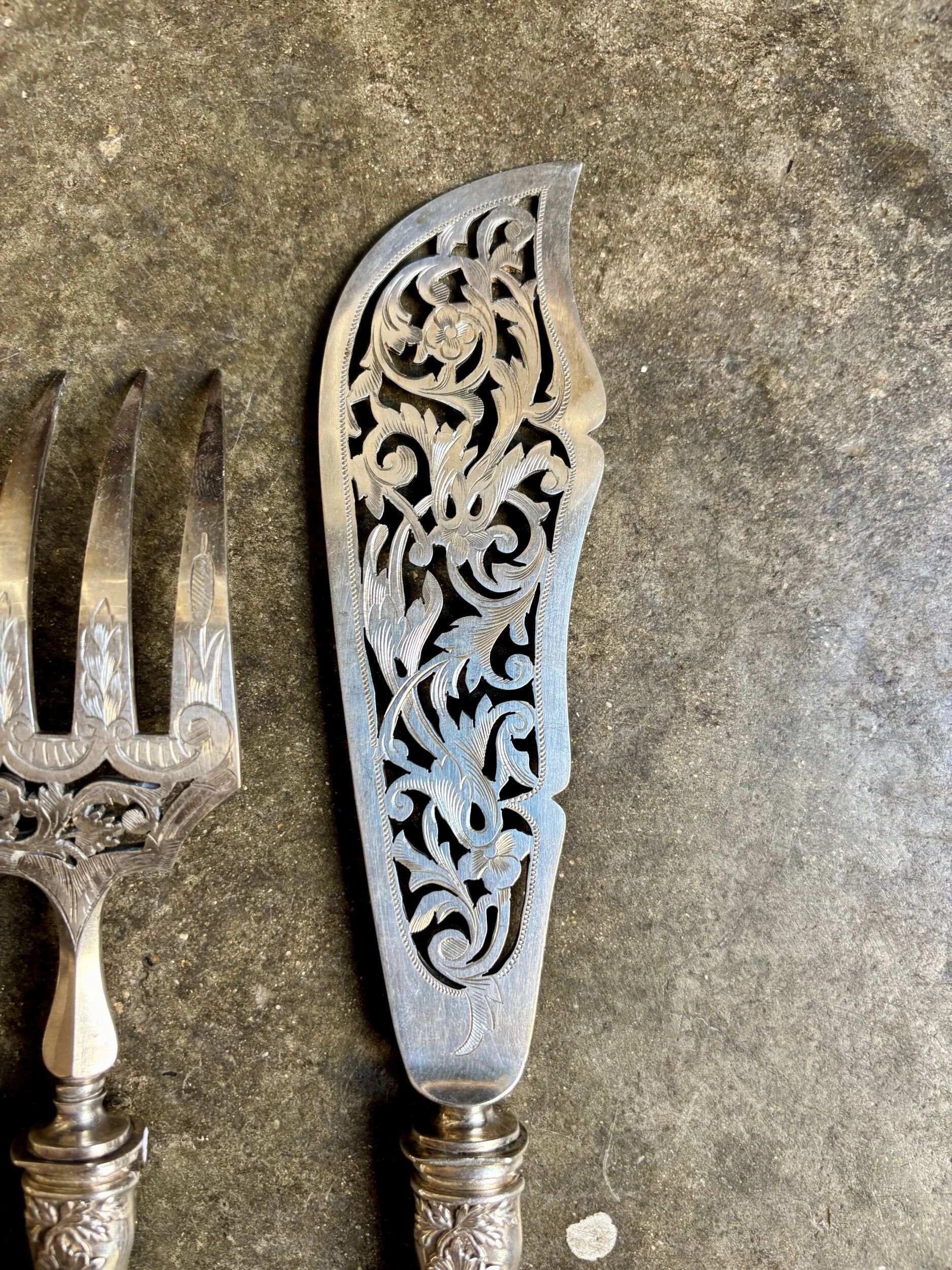 2 silver openwork service cutlery sets engraved with "AS"