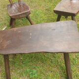 Four chairs and brutalist coffee table