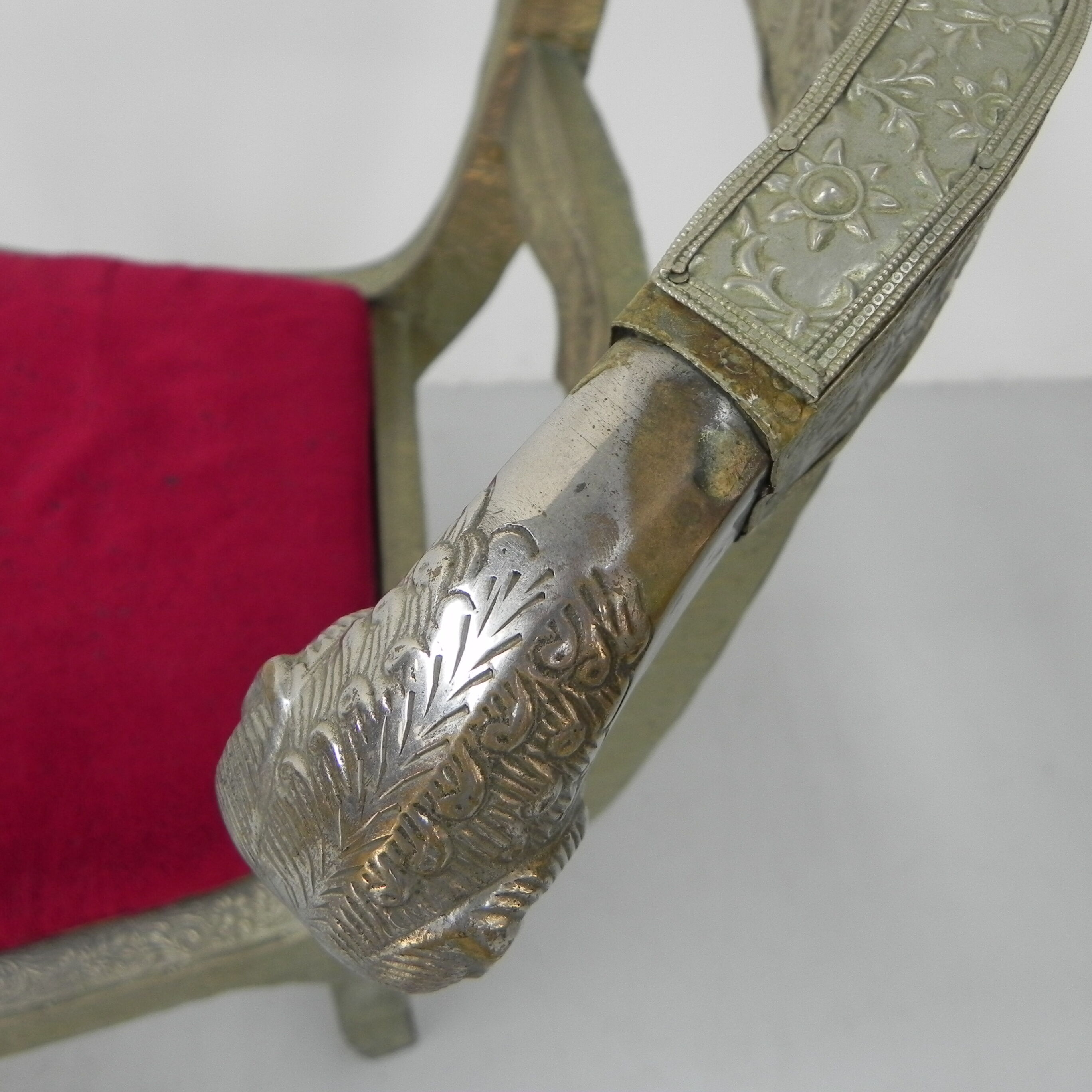 Dining chair upholstered with stamped tin
