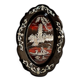 Marquetes lacquer dish with mother-of-pearl inlays figuring 3 characters on a boat in front of a temple.