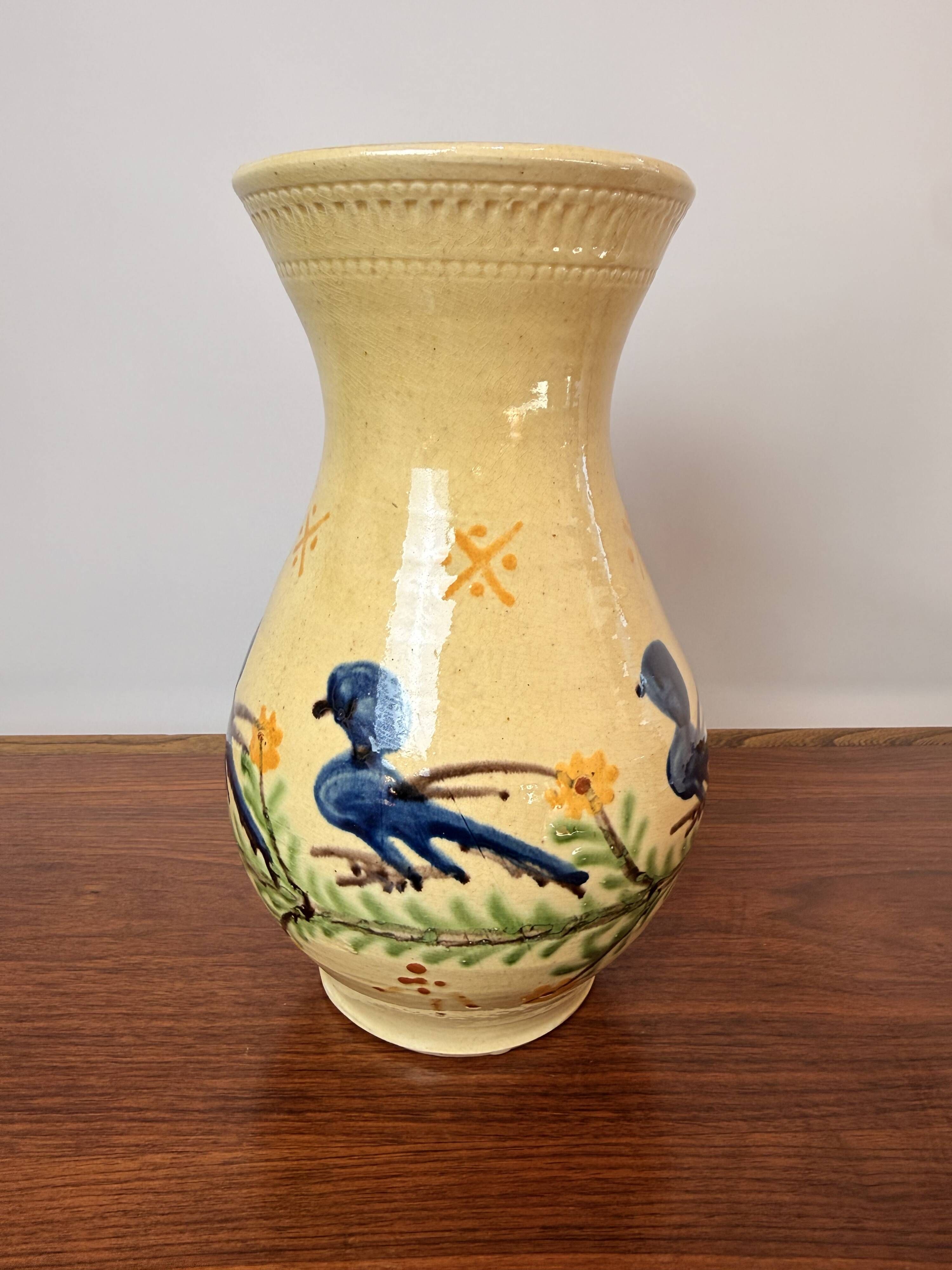 Large vase in glazed pottery decorated with blue birds and flowers.
