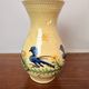 Large vase in glazed pottery decorated with blue birds and flowers.
