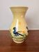 Large vase in glazed pottery decorated with blue birds and flowers.