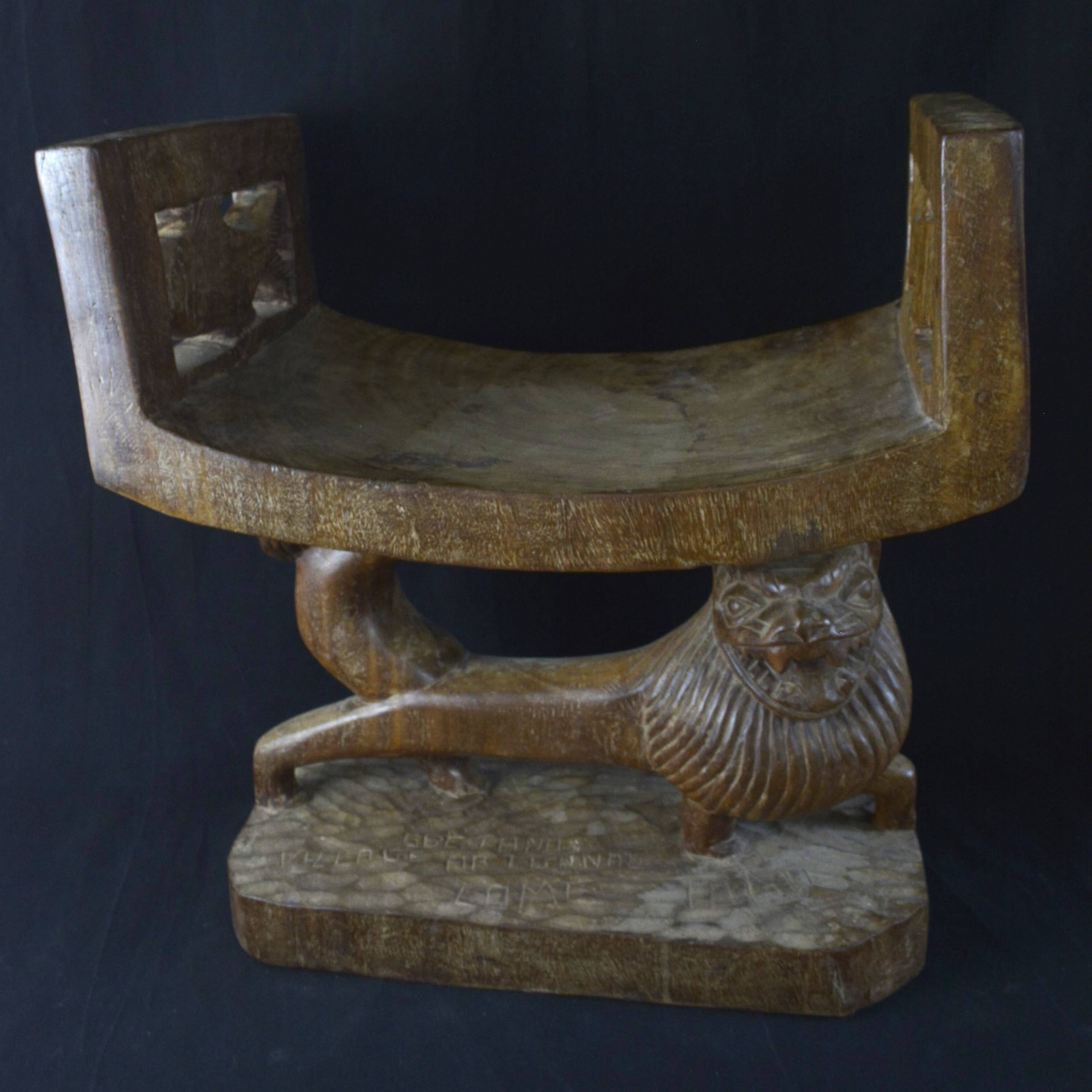 Togolese ethnic stool in carved exotic wood.