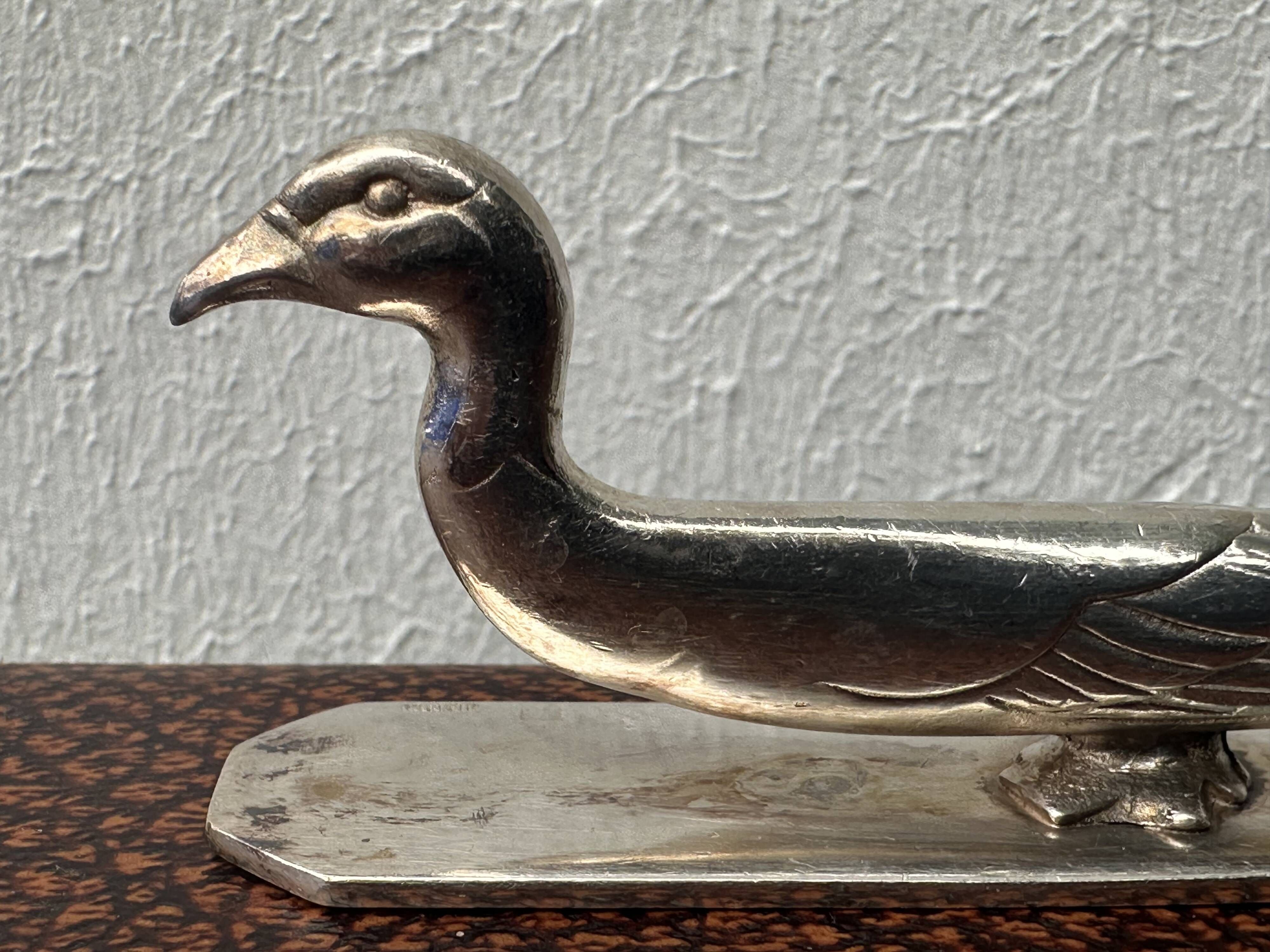 12 antique silver-plated bronze knife rests in modern art deco animal designs.