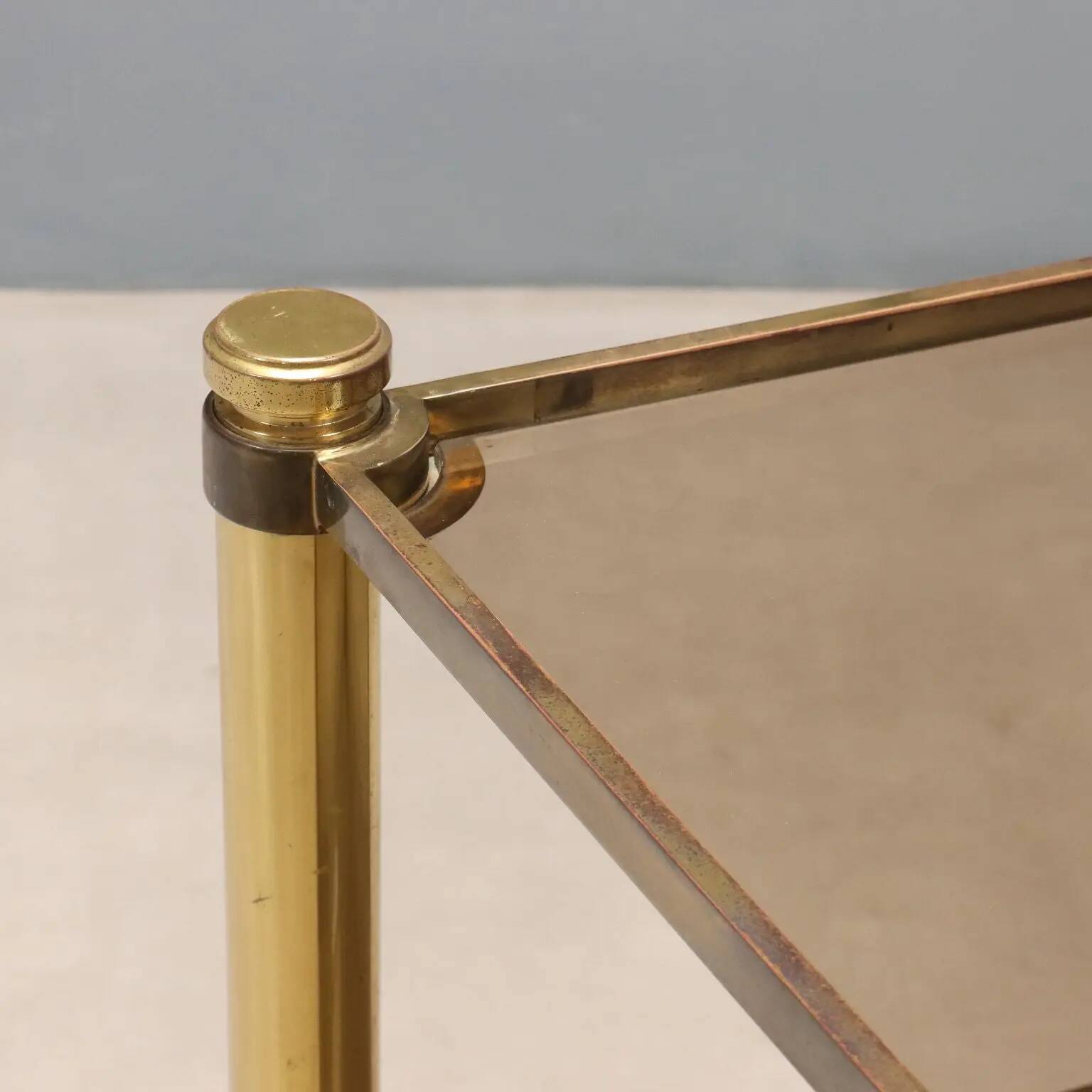 Vintage brass coffee table with glass top, Italian design 1970s.