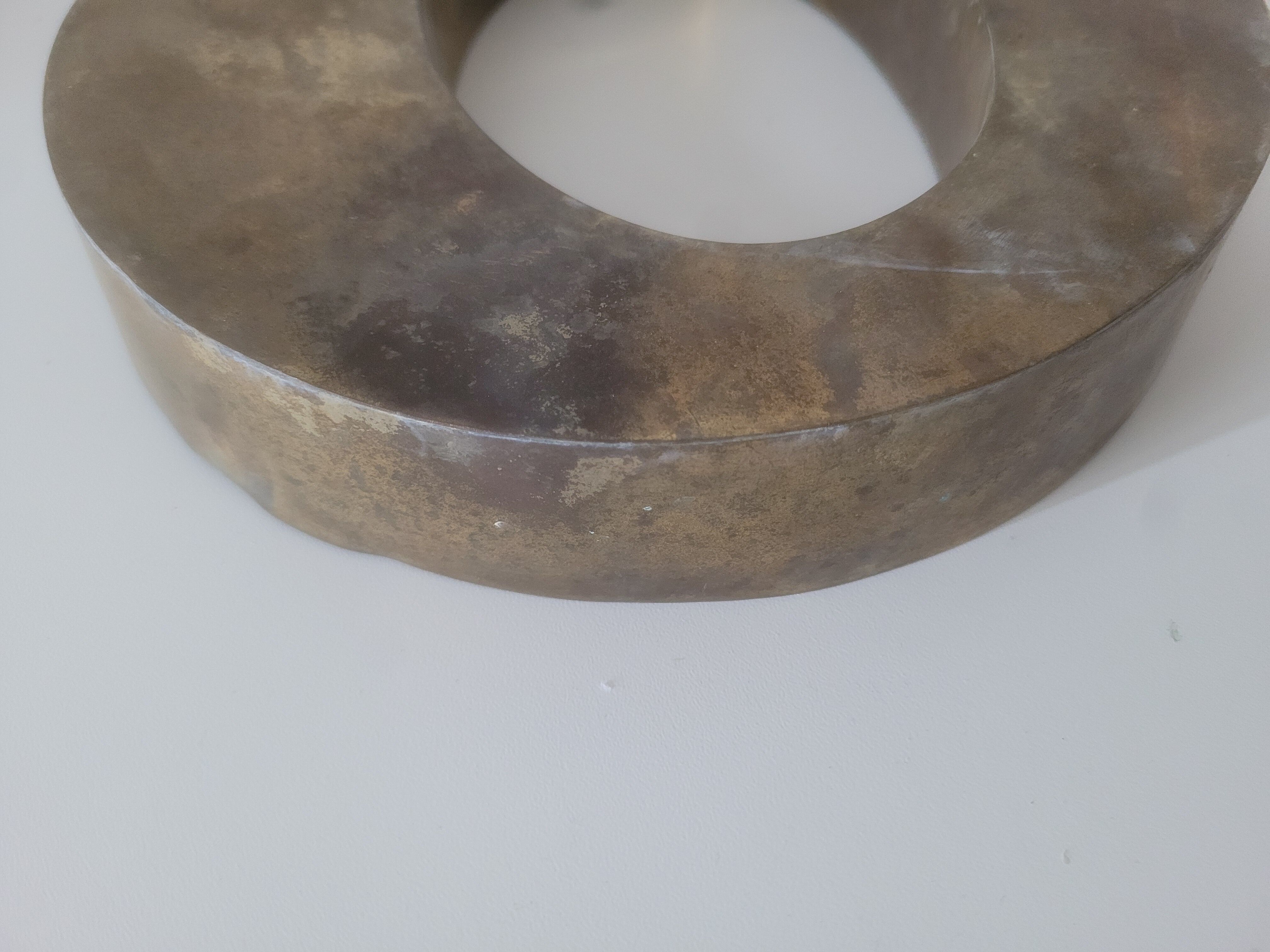 Letter O of sign in vintage gilded brass