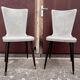 Pair of Chairs Baumann model Essor in imitation white leather, beech compass base