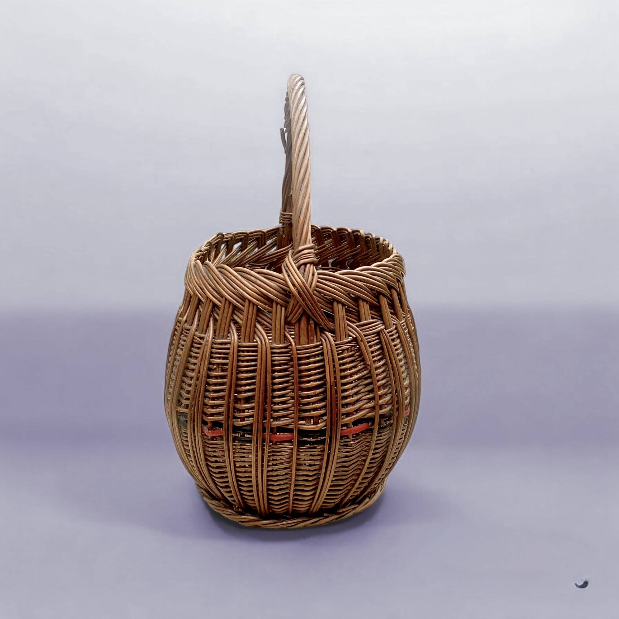 Old woven wicker basket and scoubidou