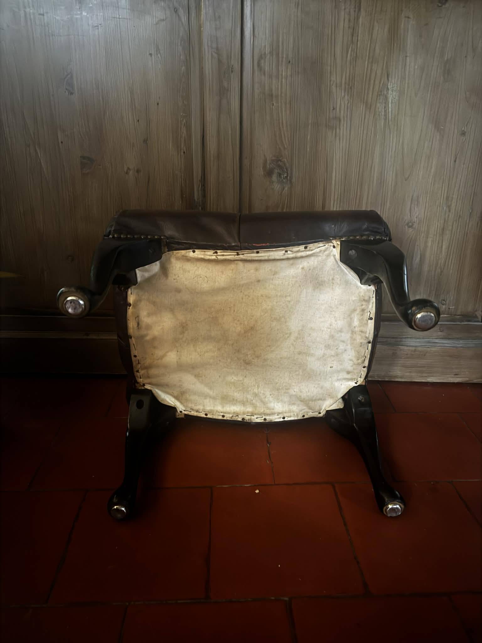 Red leather footrest in Chesterfield style, vintage 1970s.