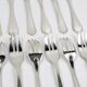 Christofle – 12 Spatours dessert forks in silver-plated metal, with case.