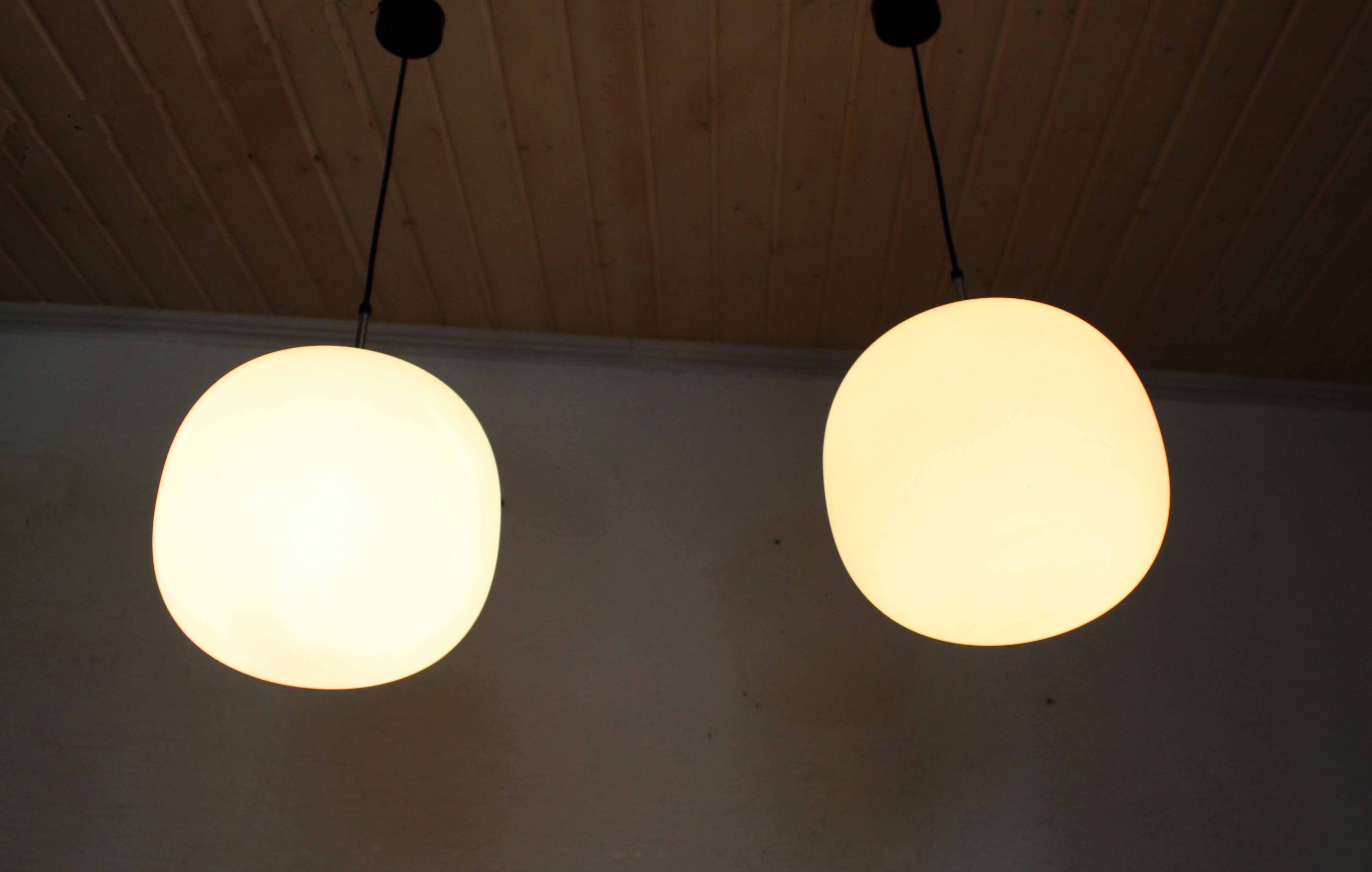 Pair of opal glass pendant lights