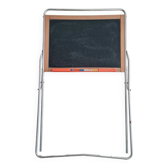 Slate board and target on the back of an old toy