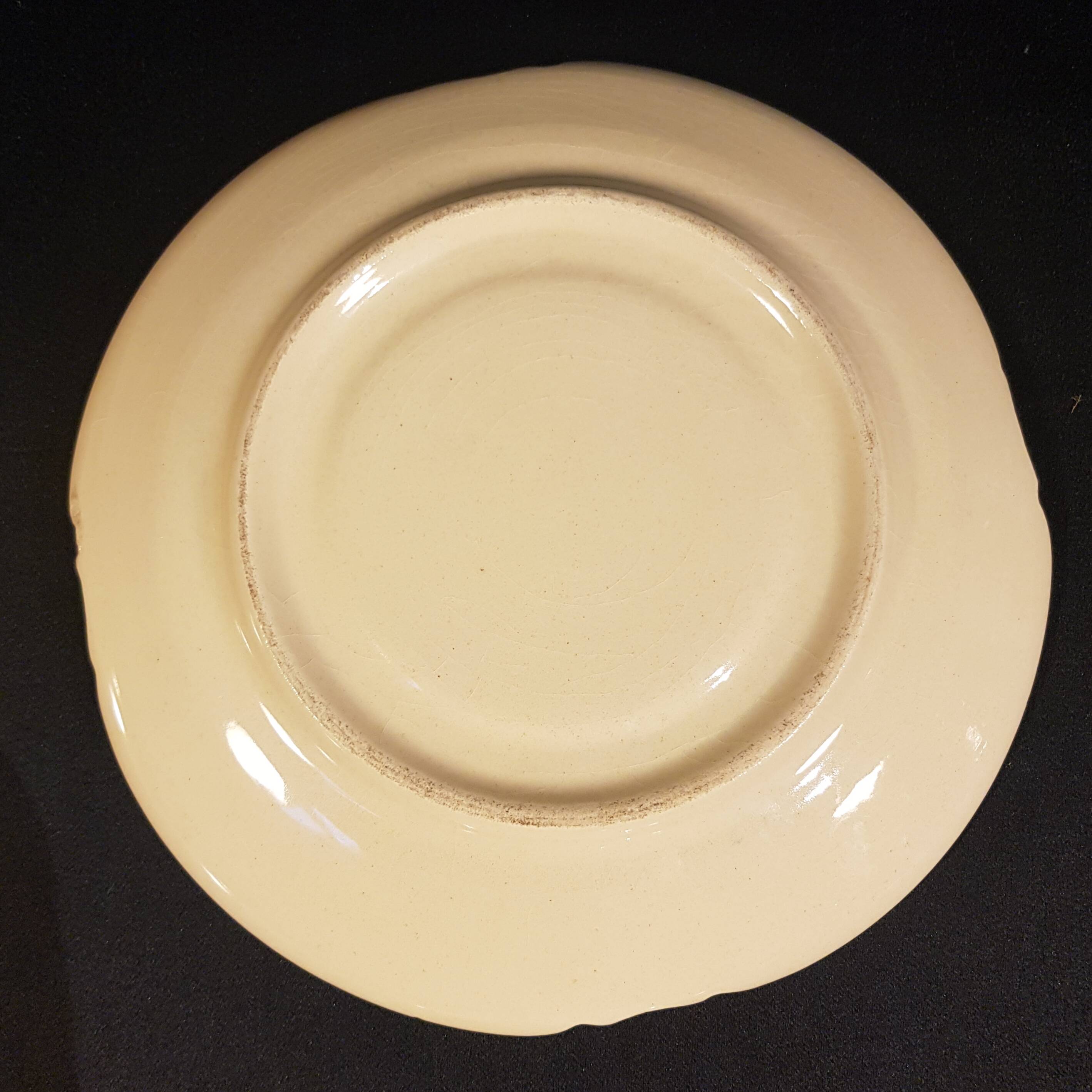 4 Quimper earthenware saucers or plates