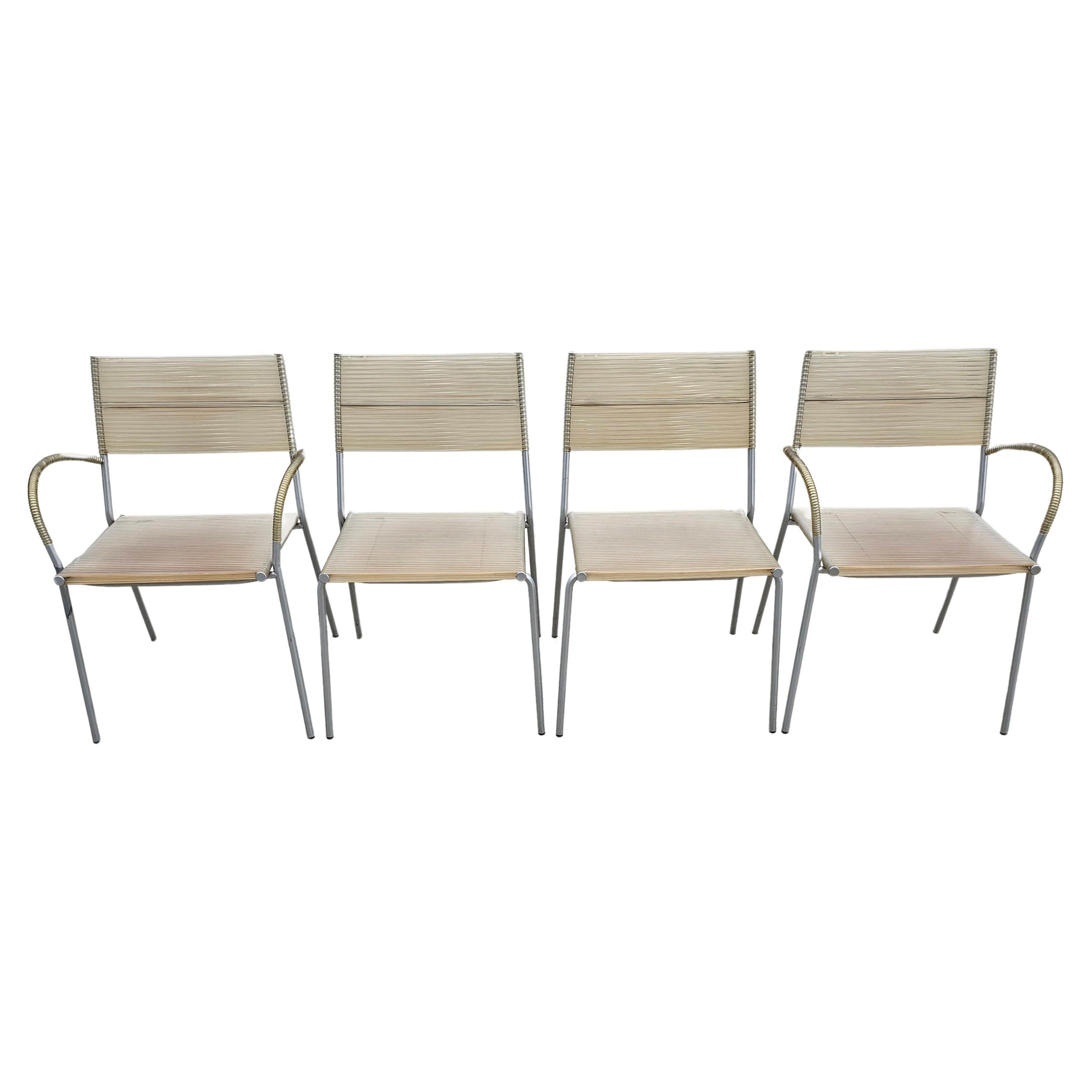 Set of 4 Miss B dining chairs by Tito Agnoli for Bonacina, 1990s.