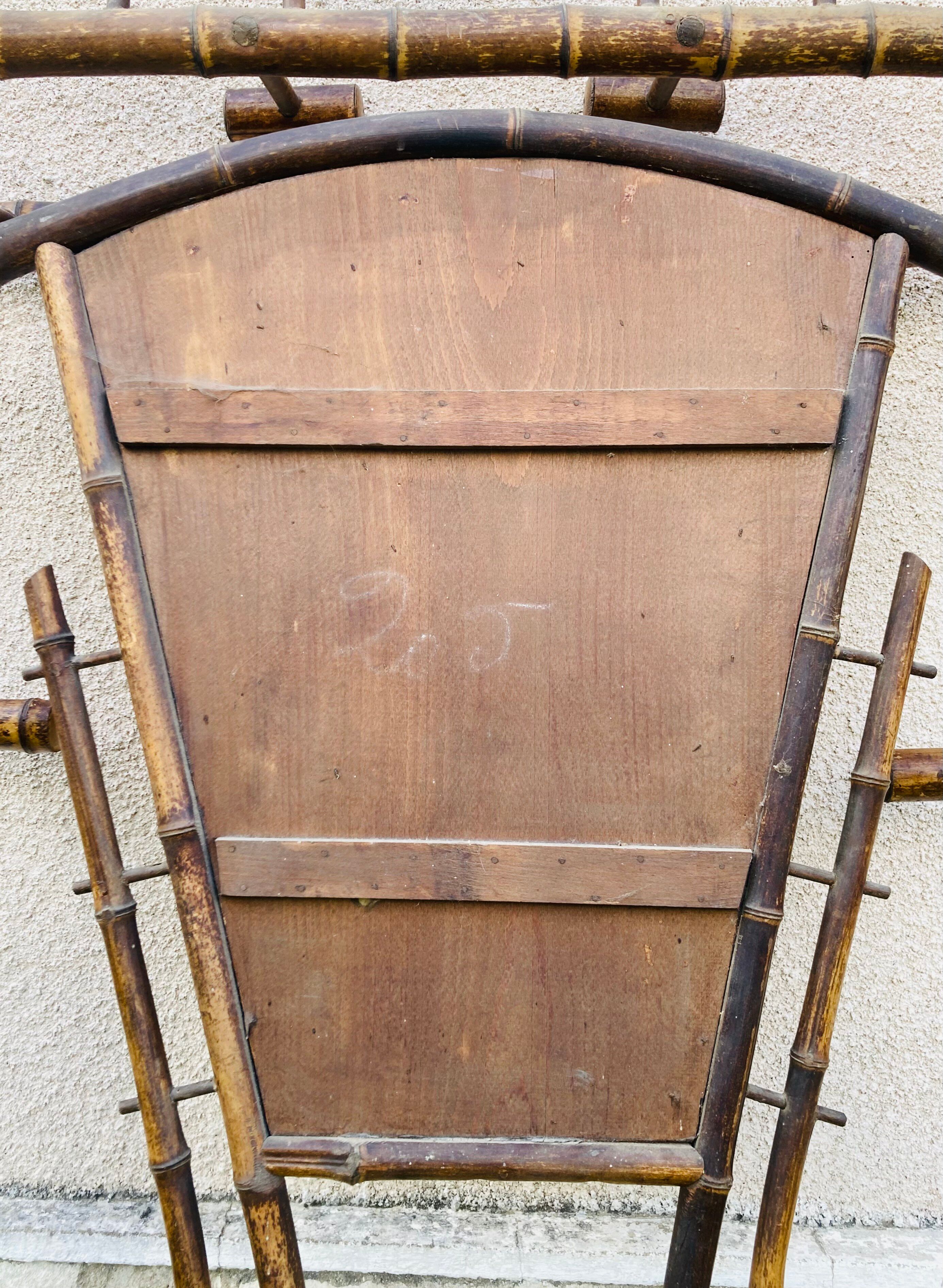 Bamboo coat rack from the 19th century, mirror in the shape of a crescent moon.