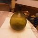 Old green glass demijeanne