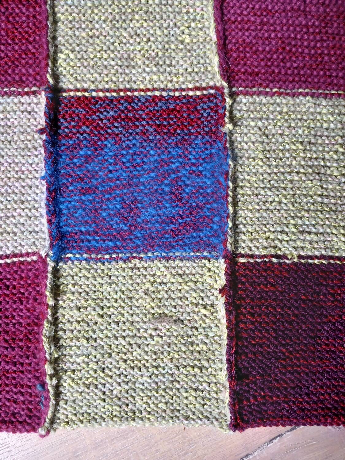 Hand knitted patchwork plaid