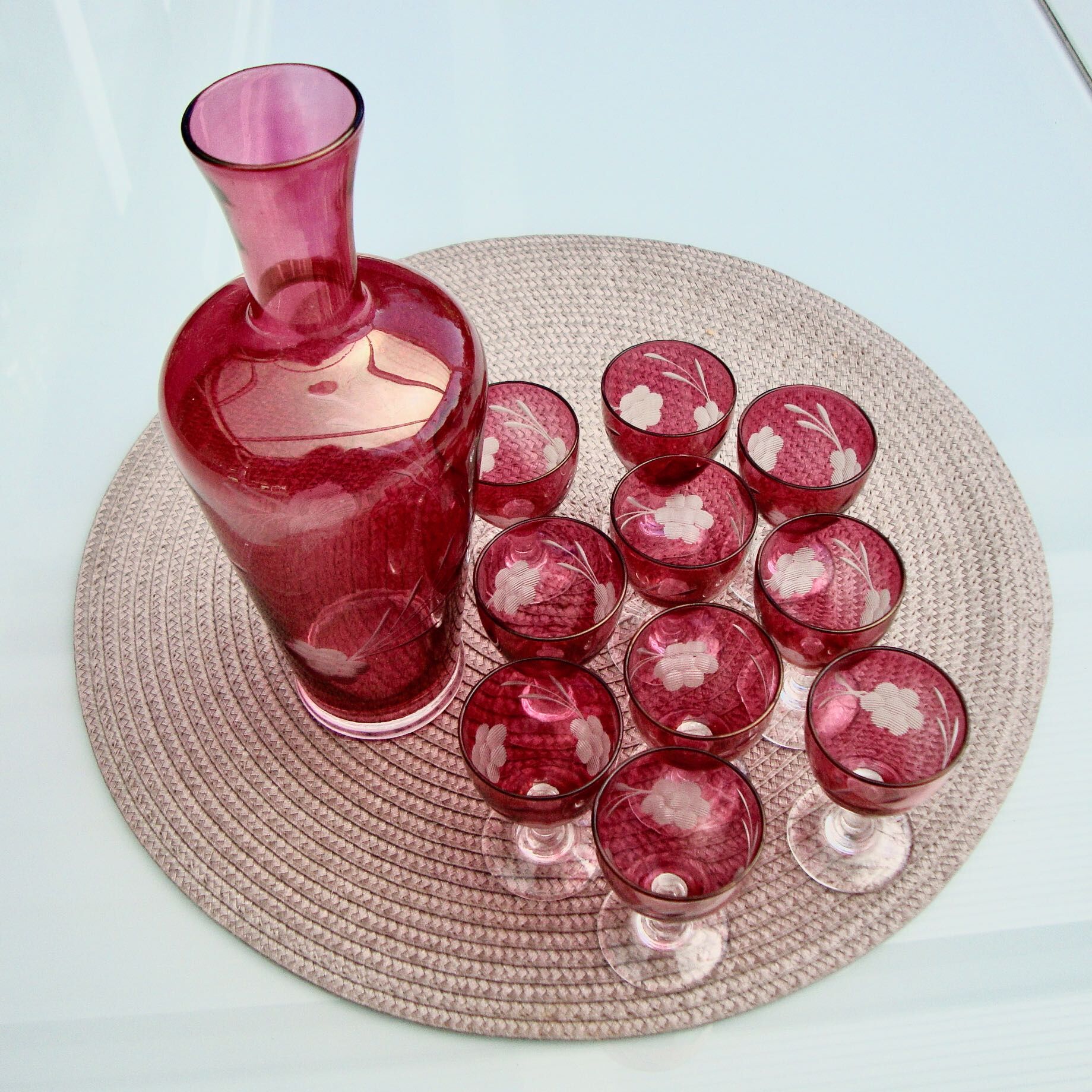 10 glasses and carafe with alcohol or liquor